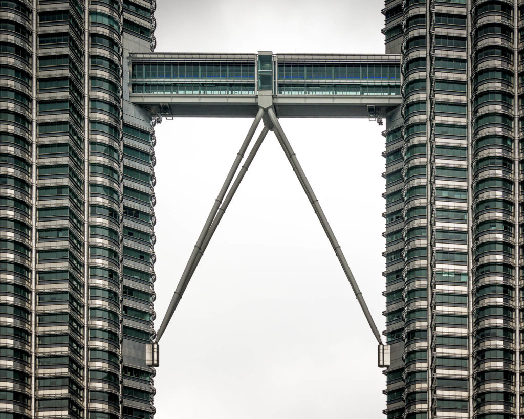 Bridge joining two twin towers - Find Away Photography